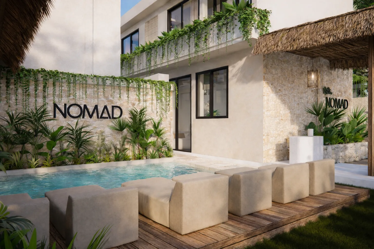 Pool with the NOMAD logo, beanbags and a lounge area
